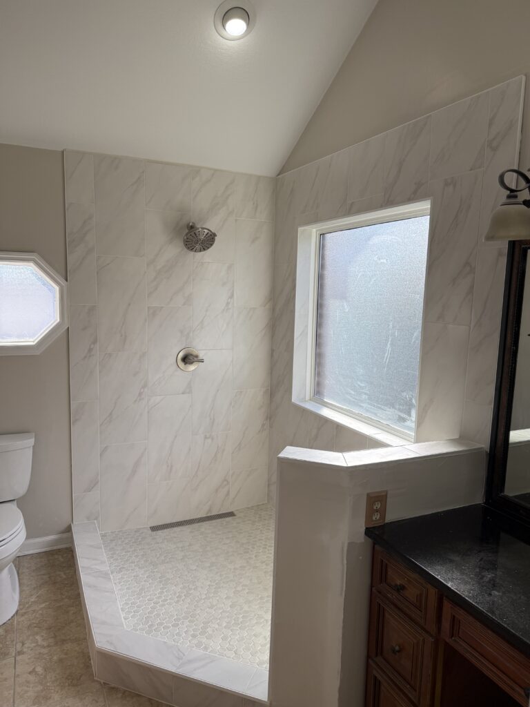 Marble bathroom with a skylight