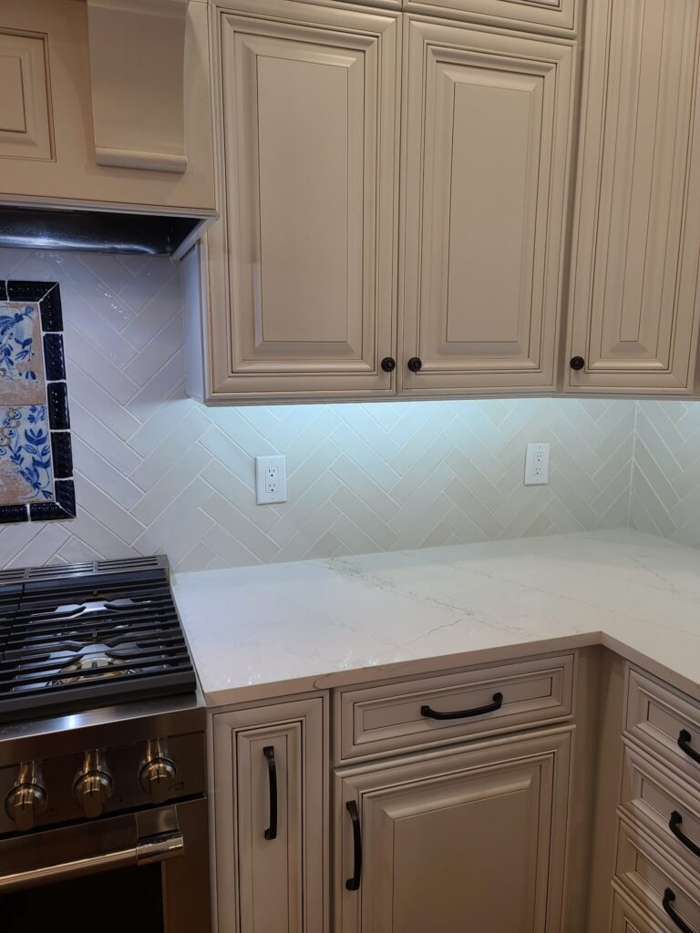 Herringbone backsplash tile under white cabinets, Calhoun, GA
