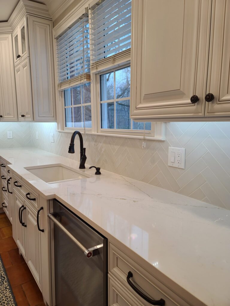 Herringbone backsplash along the sink wall, Calhoun, GA by Palacios Installation