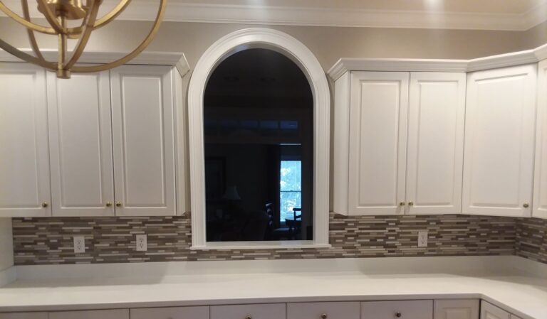 Mosaic tile backsplash around an arched window, Dalton, GA by Palacios Installation