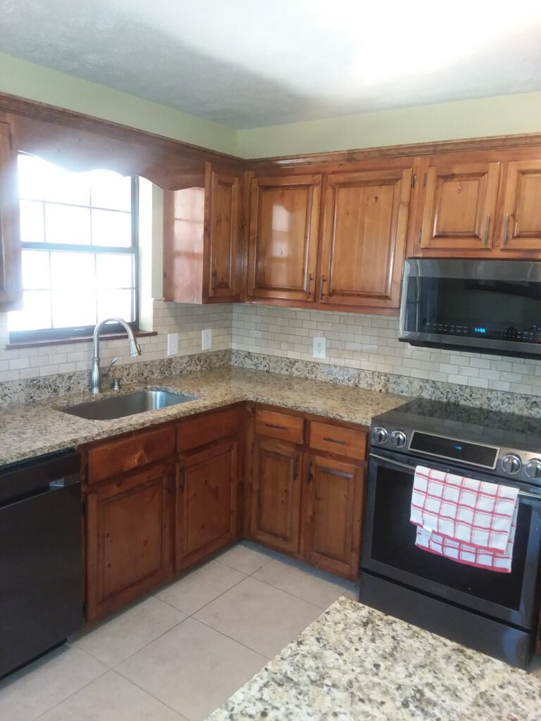 Subway tile backsplash with wood cabinets, Dalton, GA by Palacios Installation